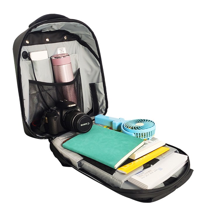 Black Ldb Ledback HD Smart LED Laptop Backpack opened fully and illustrating the flexibility and capacity of school supplies, water bottle, and a DSLR camera, viewed at an angle, isolated on a transparent background.